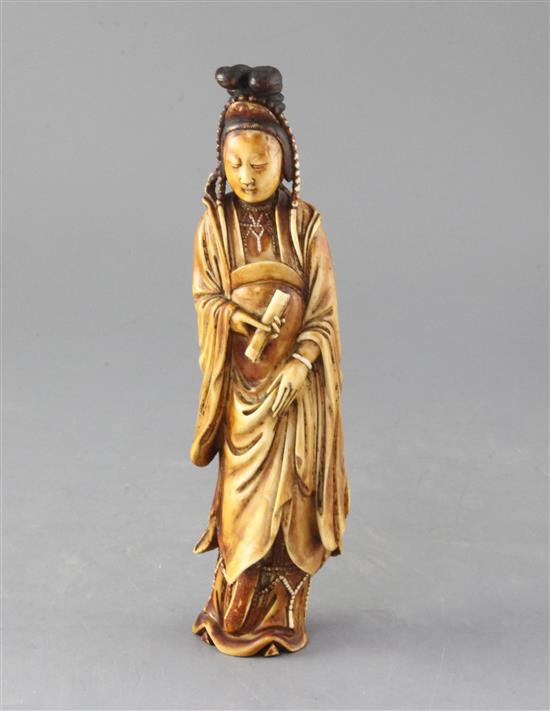 A Chinese Ming dynasty ivory figure of Guanyin, 17th century, 23cm high